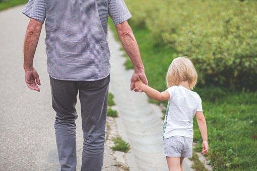 Adult and child walking