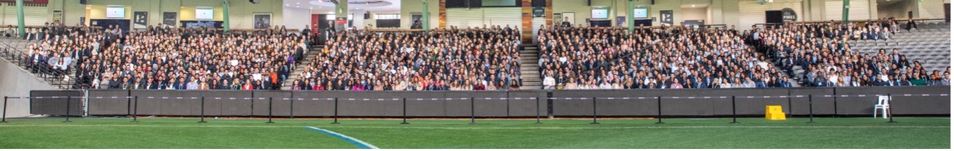 Attendees of the 2023 MD Student Conference sitting in the stands of Marvel Stadium.