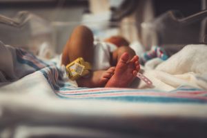 Newborn bay with a hospital ankle tag