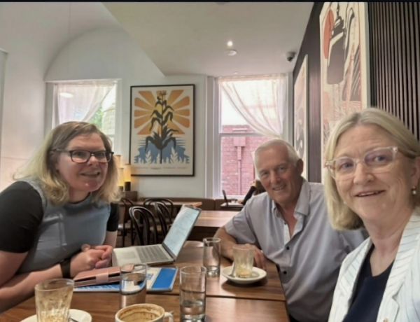 Photo of 3 researchers smiling at camera