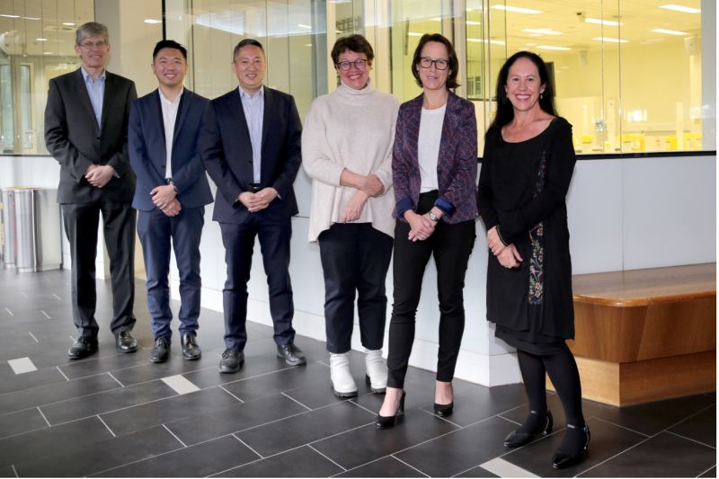 Professor Christopher Fairley, Associate Professor Eric Chow, Professor Marcus Chen, Professor Jane Hocking, Professor Deborah Williamson from the Department of Infectious Diseases, and Professor Catriona Bradshaw posing for a photo at the Doherty Institute foyer.