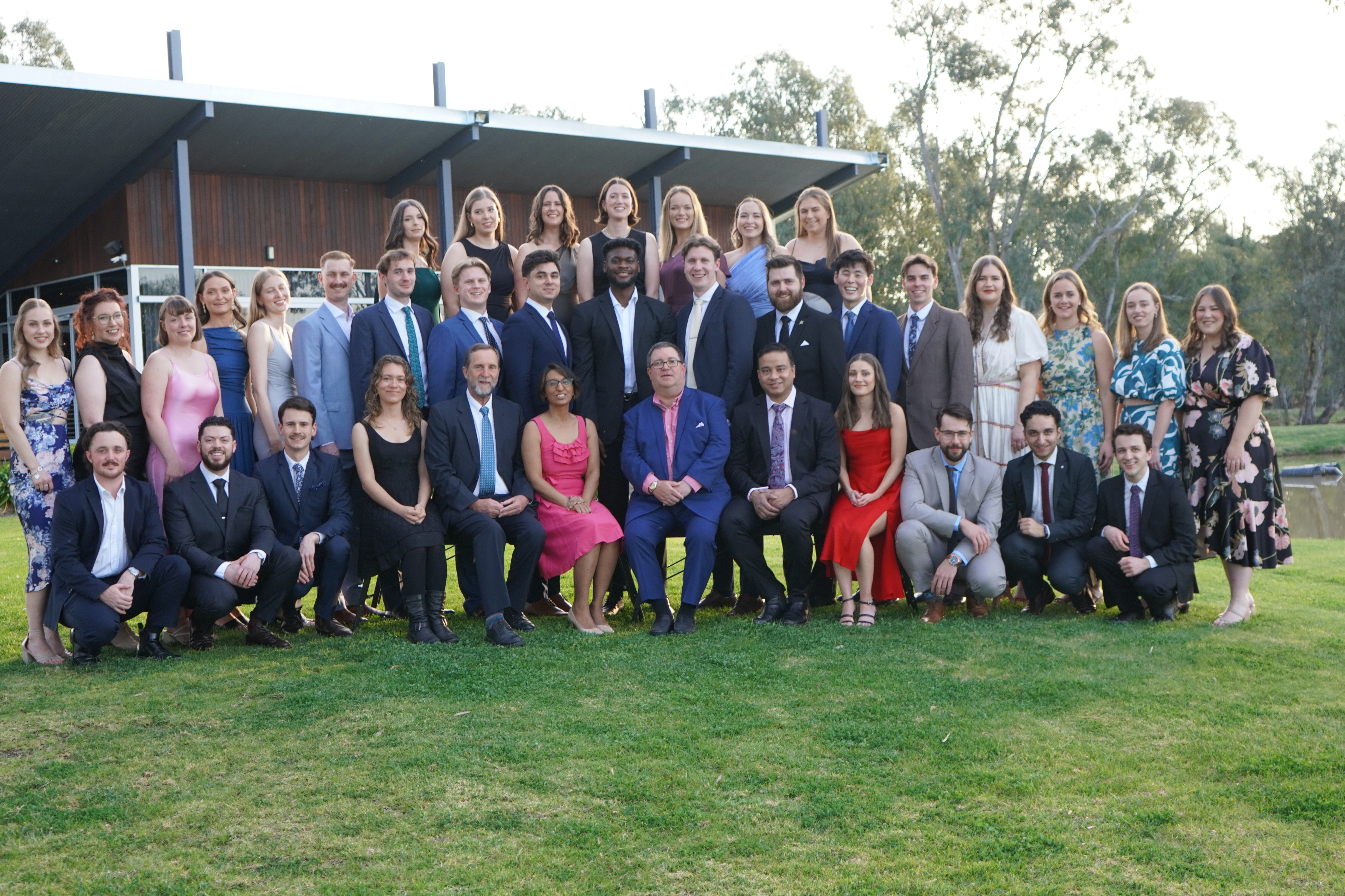 Graduating class photo in front of venue. 