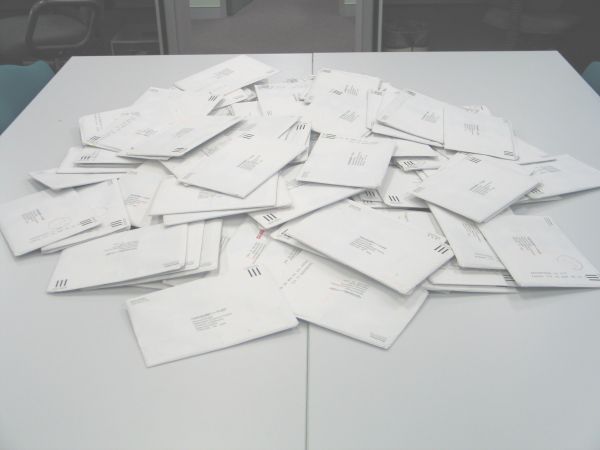 A large pile of envelopes. THey are all addressed to the Diamond Project