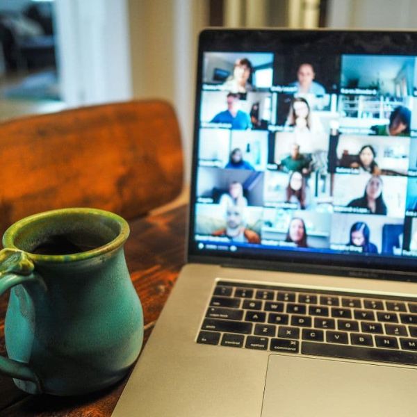 Open laptop showing online seminar