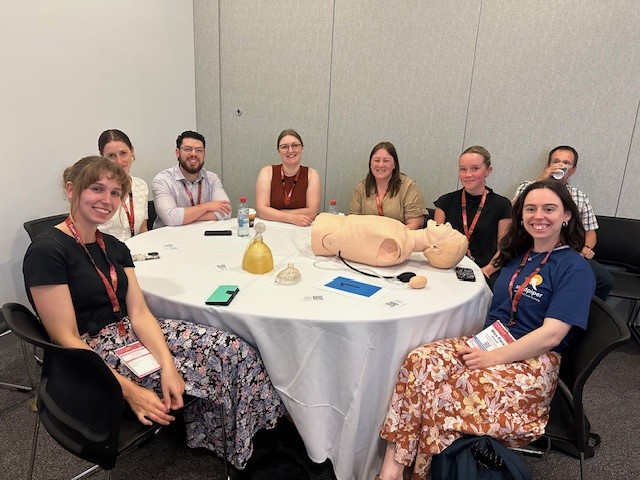 Medical students sitting at table