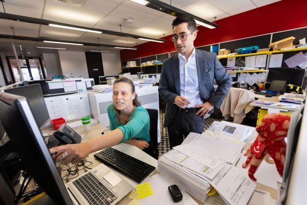 Professor Piero Perucca and epilepsy Research Nurse, Heather Robinson, looking at a computer screen at the Austin Brain Centre