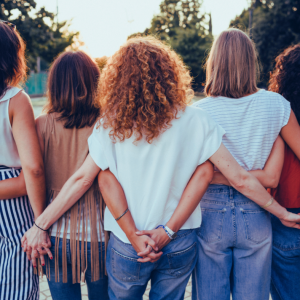 Image for Group of women hugging, view from behind
