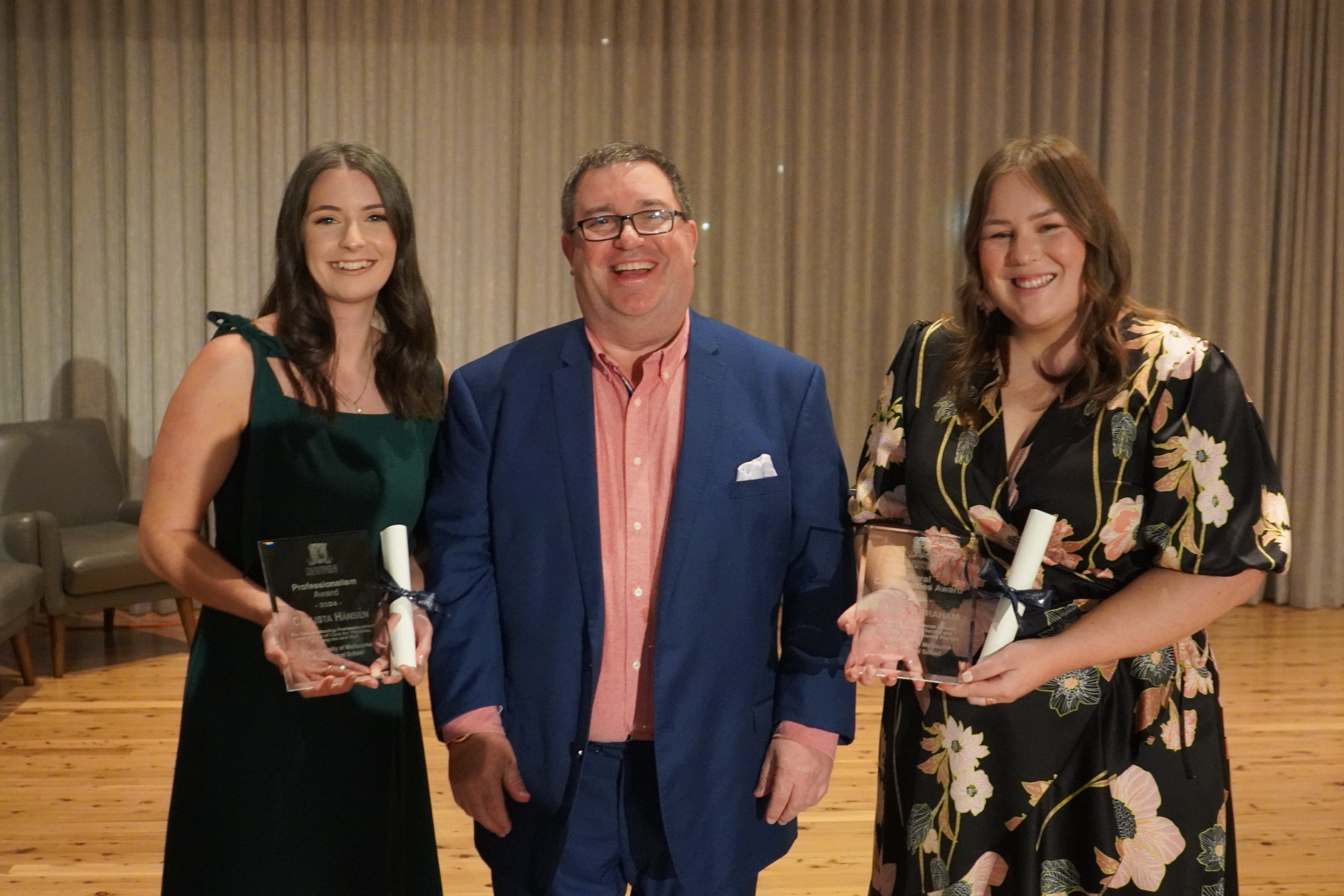 Award winners posing with Professor.