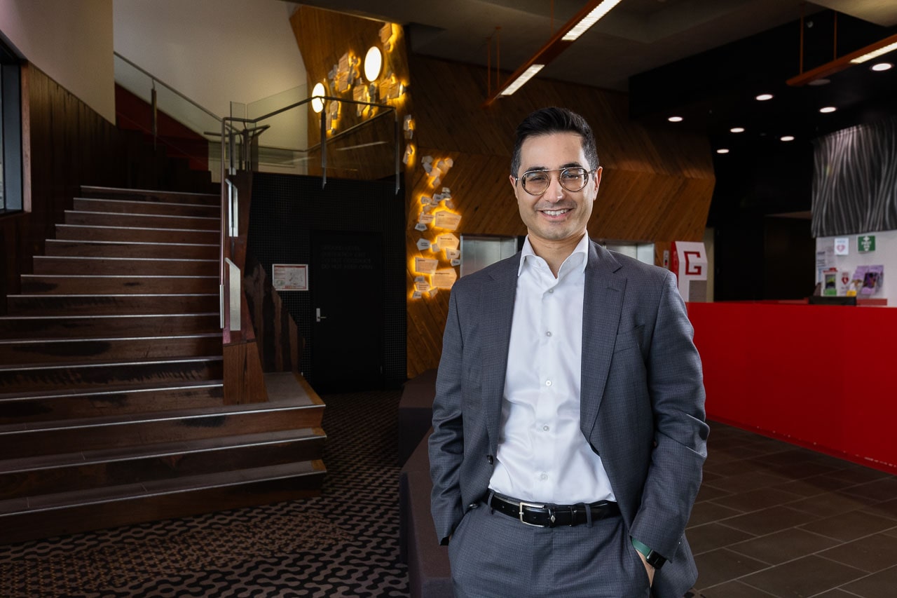 Professor Piero Perucca at the entrance of the Melbourne Brain Centre, at the Austin