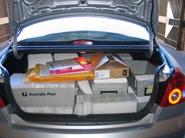 Open car boot filled with documents