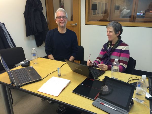 2 researchers sitting next to each other in an office